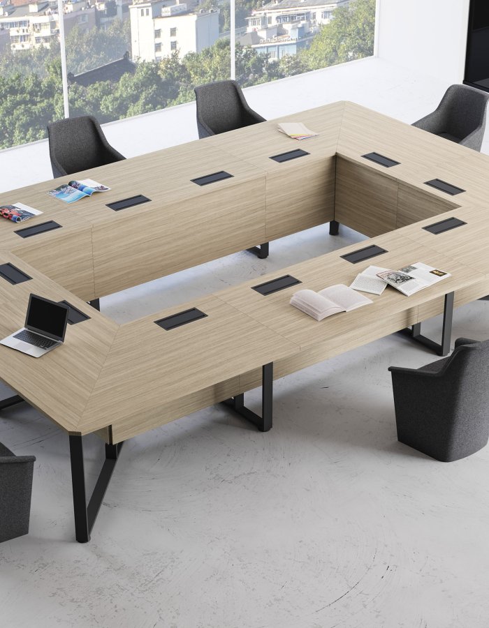 Meeting room with Las Mobili IMeet open-square conference table, cable flaps and grey armchairs