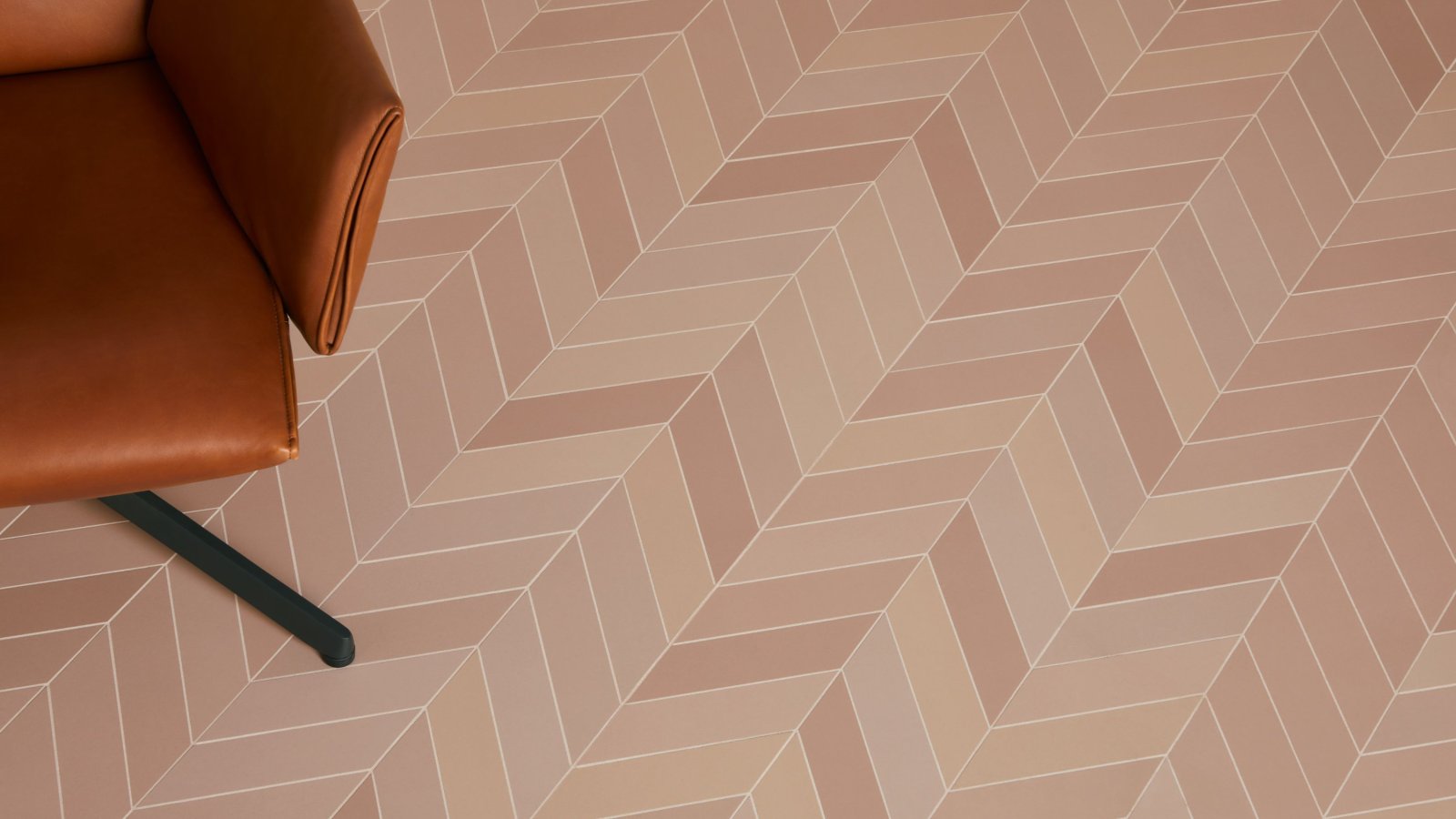 Mews tiles by Barber and Osgerby in Fog cladding a meeting room wall