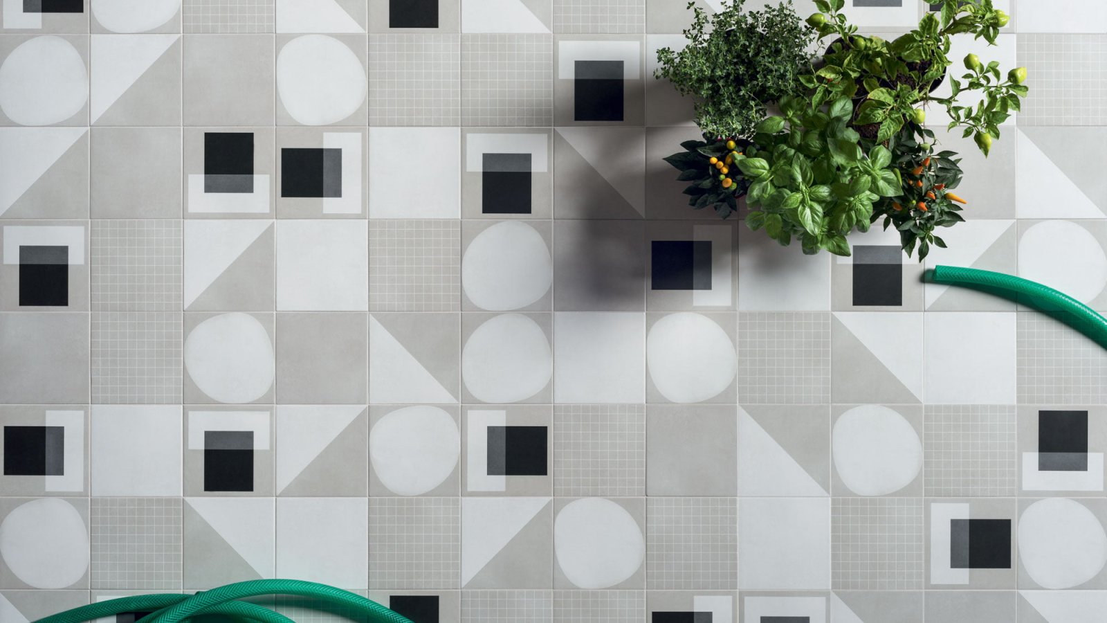 Designer ceramic tiles Futura by 41zero42 in a 15x15 cm format on a bathroom wall