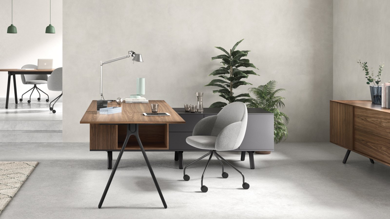 Designer desks Lay by Archiutti with light grey tops and red structure in an open-plan office
