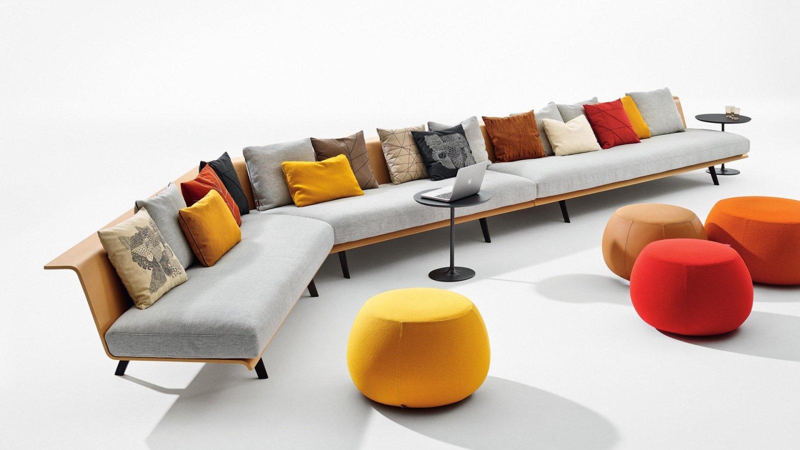 Zinta modular seating by Arper with visible wooden shell in a canteen