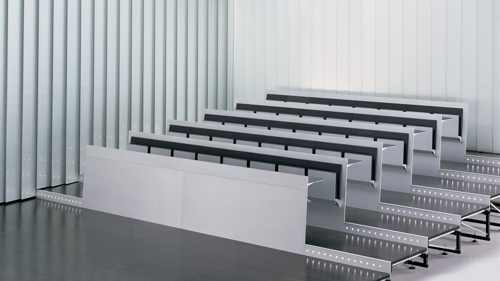 Row of Blade System study benches by Lamm seen along a lecture theatre tier