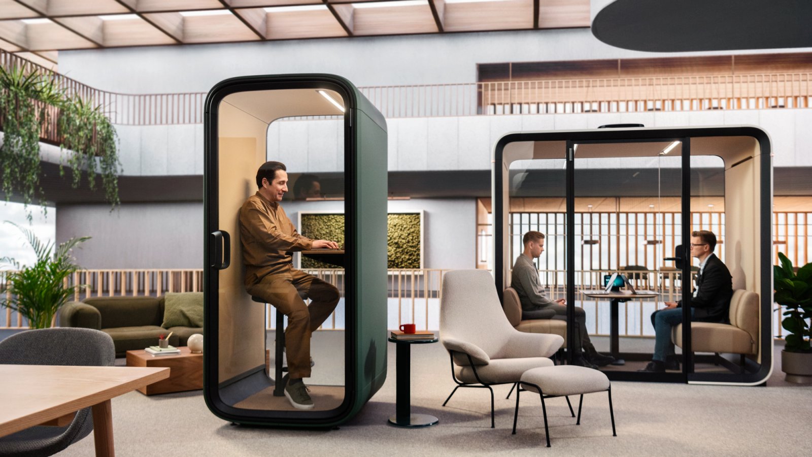 Framery One Compact phone booth in white inside an open plan office