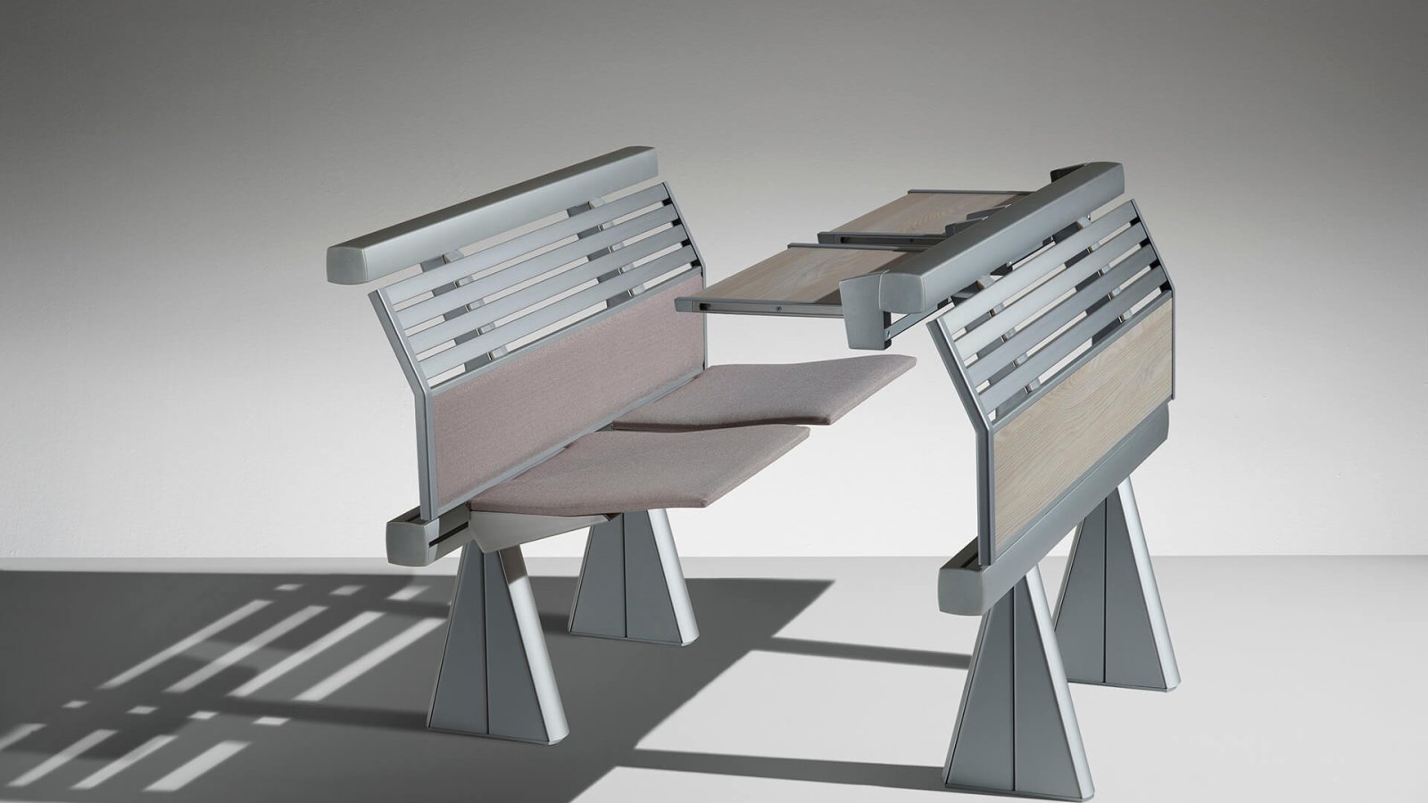 Lamm Runner lecture benches rising across a stepped hall