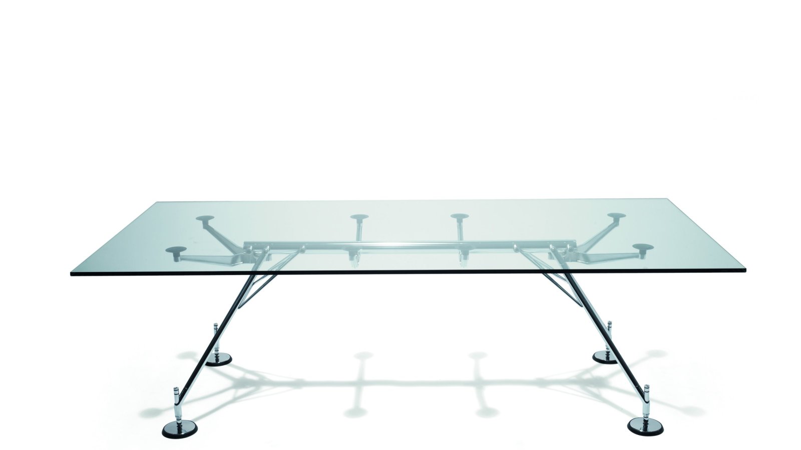 Nomos desk system by Tecno with tubular metal backbone and tempered glass top