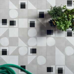 Designer ceramic tiles Futura by 41zero42 in a 15x15 cm format on a bathroom wall