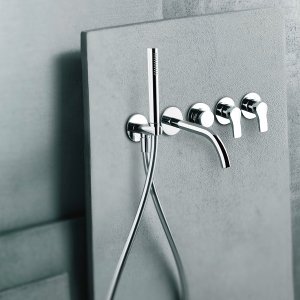 Wall-mounted AL/23 tap by Fantini, curved spout and lever on two round plates