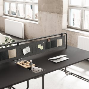 Curved sheet-metal organizer tray on the Itube bench