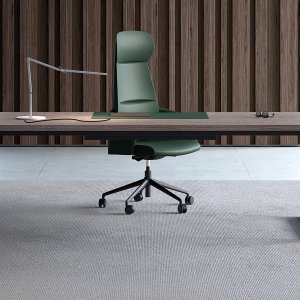 Sliding leather pad of the Arche desk open over its hidden compartment
