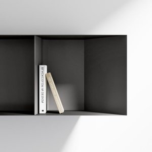 Ellan desk resting on the low bookcase in Canaletto walnut