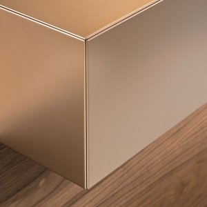 Reception desks Toki with American walnut worktop and copper flanks