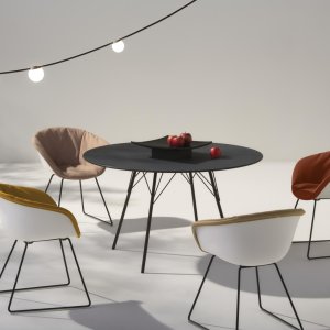 Row of stacked Leaf chairs by Arper in a restaurant