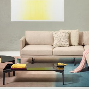 Steeve Lou two-seater sofa on its T-leg base