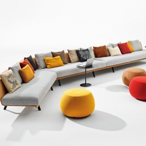 Zinta modular seating by Arper with visible wooden shell in a canteen