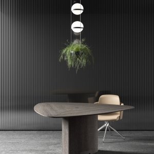Leather insert with visible stitching on a Trilo table