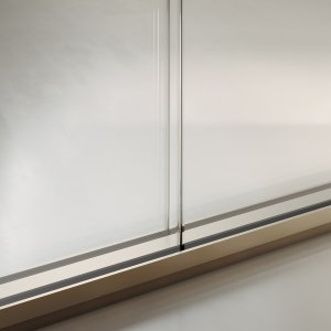 Slender partition with fluted glass for visual privacy