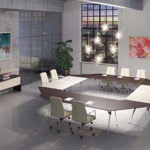 Modular Genesis meeting table in oak with chromed profile between the tops