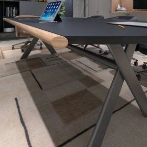 Eucalyptus top with solid walnut edge on the Sant'Andrea desk