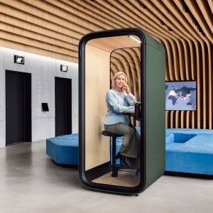 Interior of the Framery One Compact booth with birch table