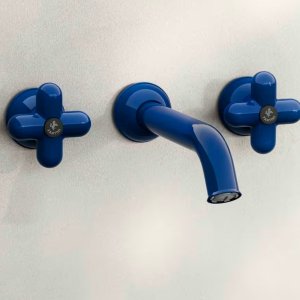 Close-up of a red four-lobed handle on its chrome base, Fantini I Balocchi