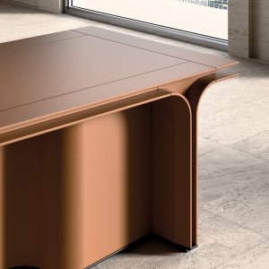 Natural Mascheroni leather on the edge of a Jazz executive desk