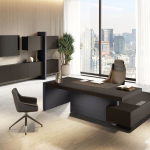 Jera executive desk — structural eco-leather side panel, Slate finish, linear stitching detail