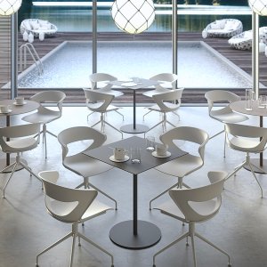 Convex round base in chrome with gas lift beneath a Grey Kastel Kicca