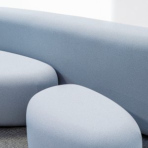 The pair of Lisse ottomans together, both level with the sofa seat