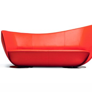 Three-quarter view of the LaCividina Mon Coeur sofa on its two disc bases