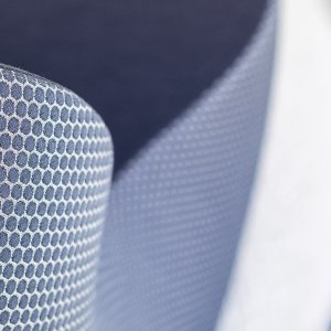 Reinforced seam running along the fabric cover of a Nautile armchair