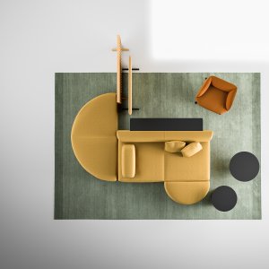 Wooden Node+ screen on its base beside a modular sofa