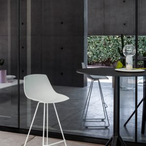 Miunn chair with sled base beside a table
