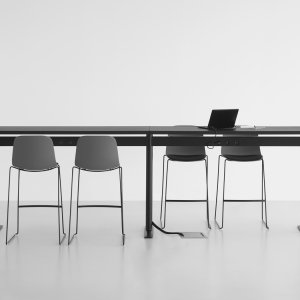 Seela chairs by Lapalma stacked at the side of the room