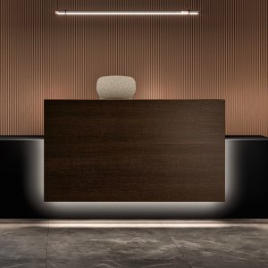Lux reception counter by Bralco with perimeter LED light switched on