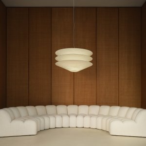 Array side table slotted between two upholstered modules