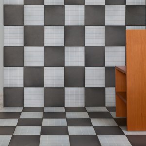 Aurore Light Grey Grid S and Grid L on an executive washroom wall