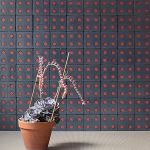 Bloc Blue Glossy wall with red Tube inserts in the holes