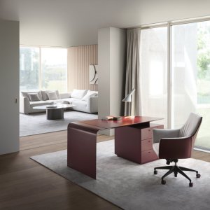 Beech plywood leg curved in a mould and covered in saddle leather
