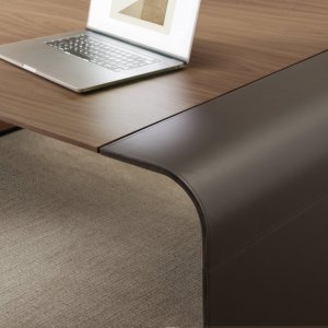 Fixed pedestal supporting the second side of the desk