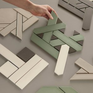 Reception wall clad in Weaving by Mutina