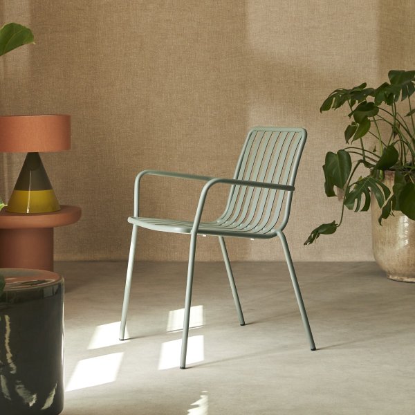Green technical plastic chairs in a UK breakout space